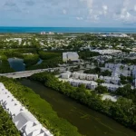 Aerial view of a Florida neighborhood with homes, possibly part of a homeowners association (HOA), showcasing organized and well-maintained properties.